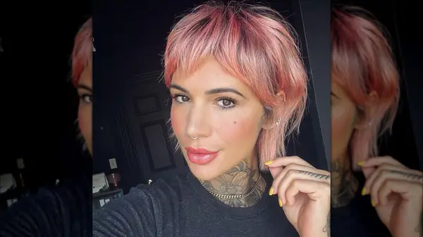 Woman with pink pixie cut