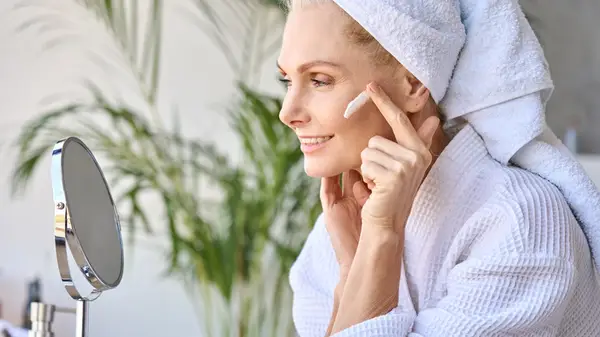 Woman applying skincare