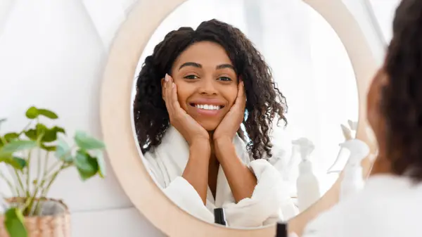 Woman smiling in the mirror