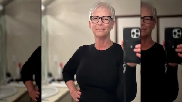 Jamie Lee Curtis taking a mirror selfie