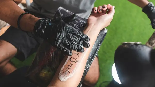 Cleaning fresh tattoo