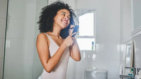 Woman brushing hair