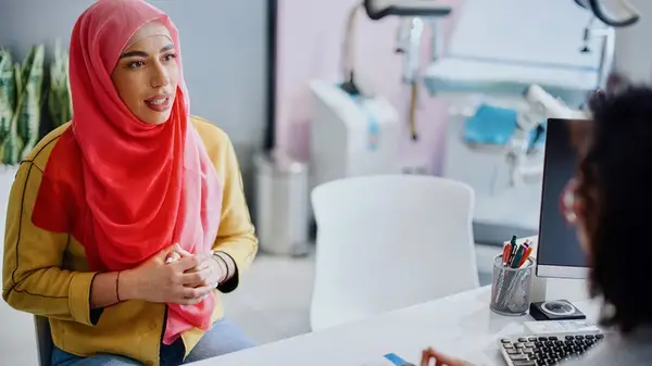 Woman consulting gynecologist