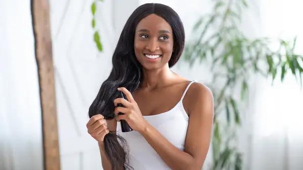 Woman spraying her hair