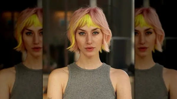 Woman with pale pink and yellow bixie haircut
