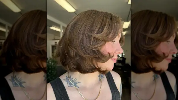 Side profile of woman with a softly blown-out bob