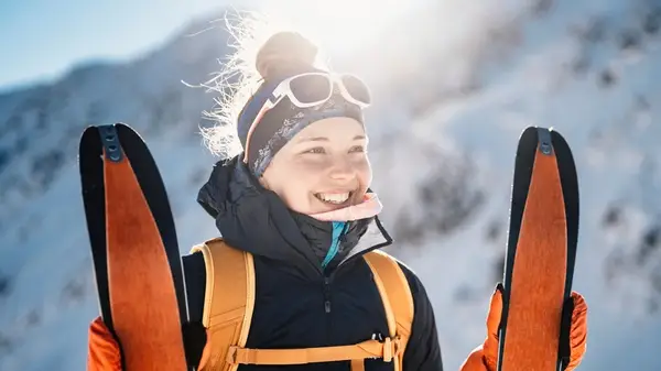 Woman smiling while skiing