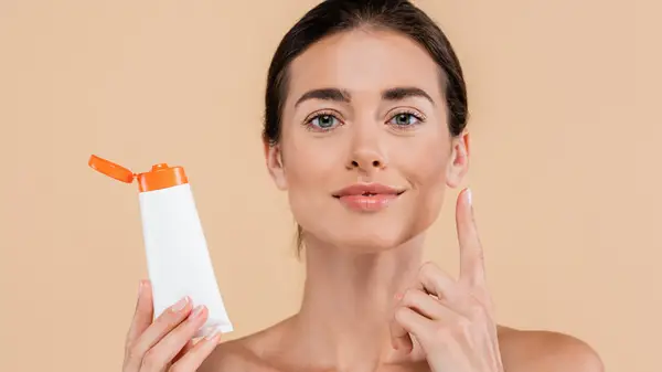 Woman applying sunscreen