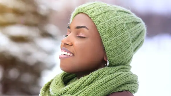 A woman wearing a winter hat