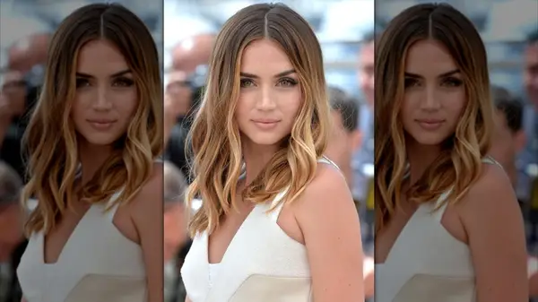 Ana de Armas posing with a balayage dye job at a photocall for 