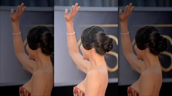 Olivia Munn on the red carpet in a white gown