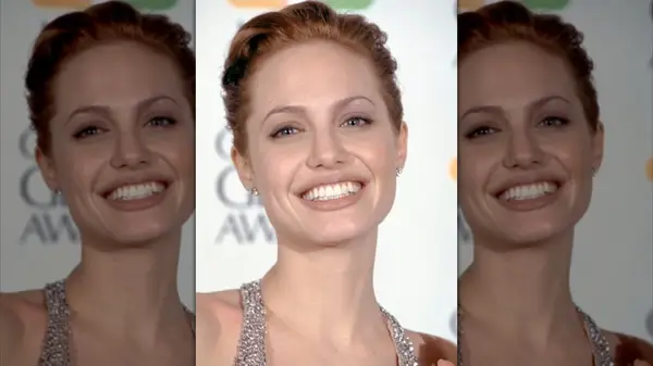 Angelina Jolie smiling on the 1999 Golden Globe Awards