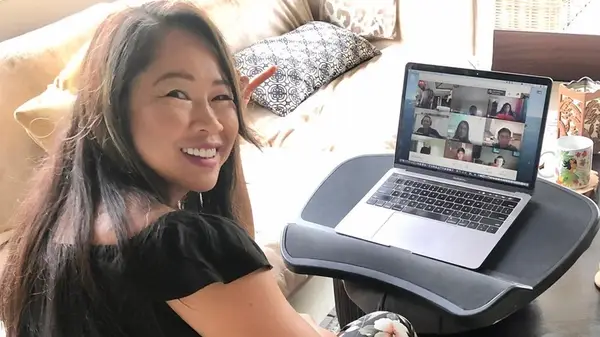 Mai Lieu on her laptop