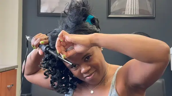 Woman having her hair curled