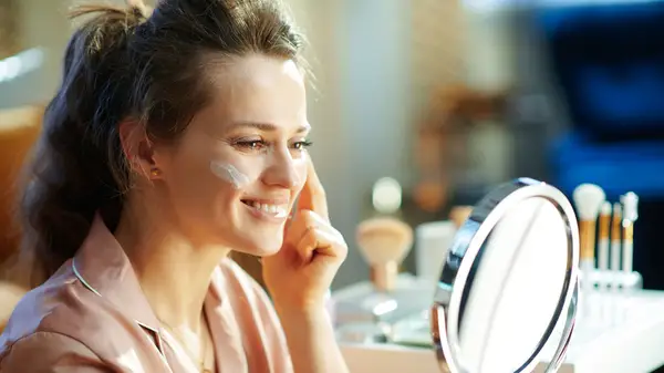 Woman applying skincare