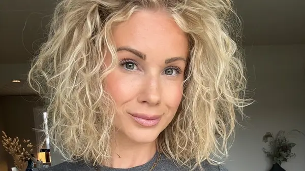 Woman with a curly bob