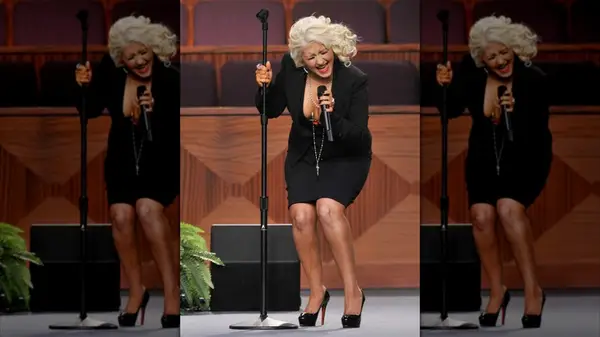 Christina Aguilera performing with tan dripping down her leg