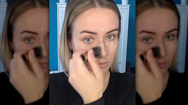 Woman applying foundation
