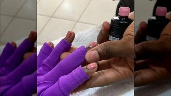 Person wearing UV gloves