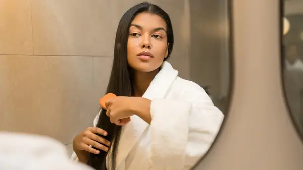 Woman brushing hair