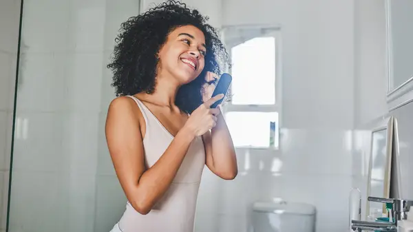 Woman brushing hair