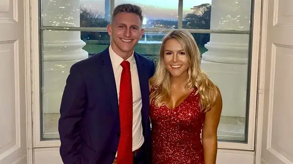 Karoline Leavitt posing with a deep tan