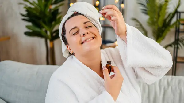 Applying oil to face