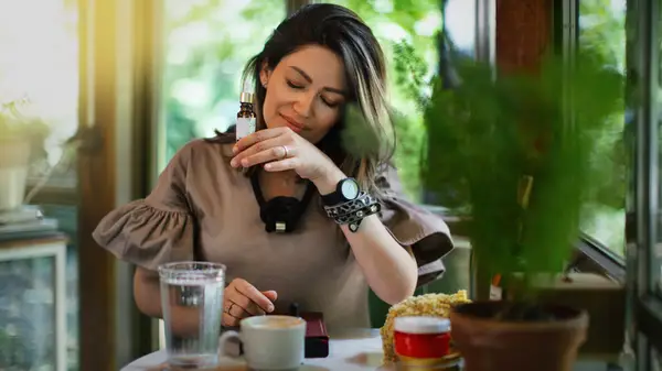 Woman enjoying a fragrant product
