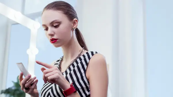 Woman studying a product