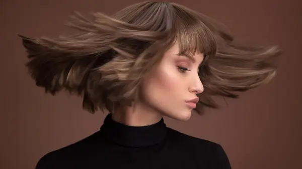 A woman shaking her hair 