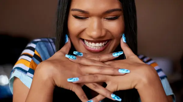 Woman with blue manicure