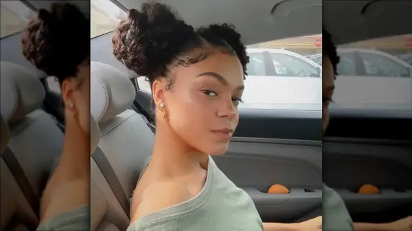 Woman taking mirror selfie