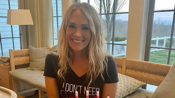 Carrie Underwood smiling with wavy hair