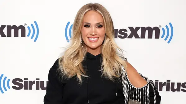 Carrie Underwood smiling on the red carpet