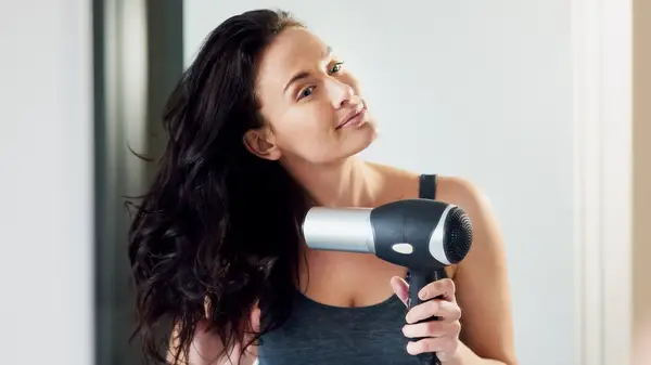 Woman drying her hair