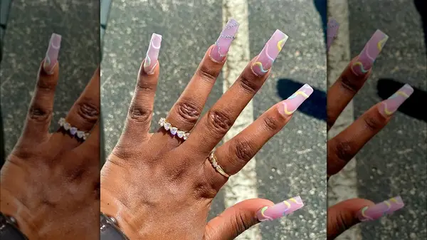 Woman with long pastel nails