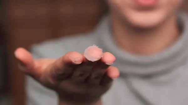 Woman with petrolatum on her hands ready to use it for slugging
