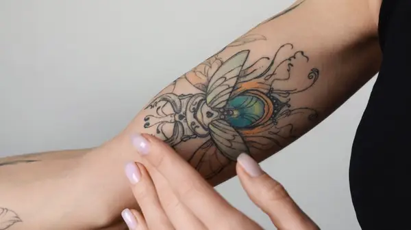 Person with arm tattoo