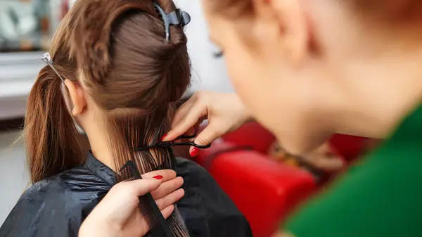 Woman giving a haircut