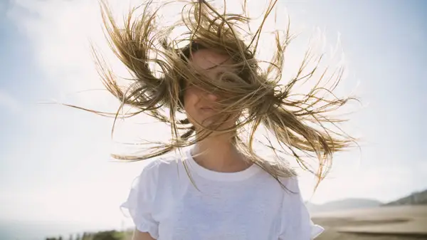 wind blows woman