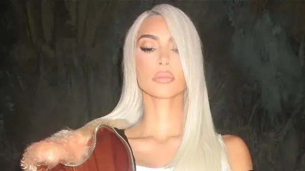 Kim Kardashian with deep side part haircut