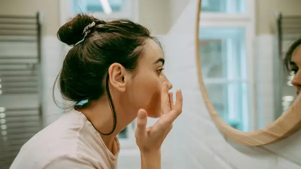 Moisturizer on butter yellow background