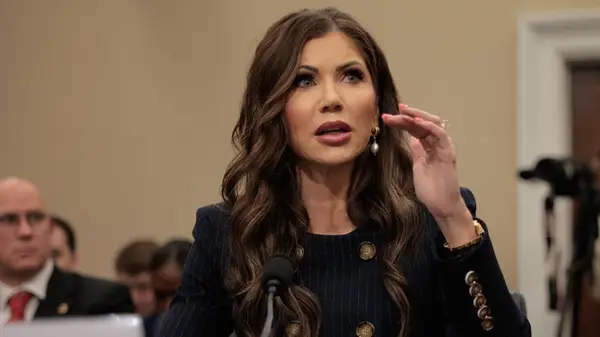 Kristi Noem with long, brunette hair