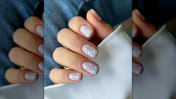 Clear wedding nails with blue flowers on Instagram