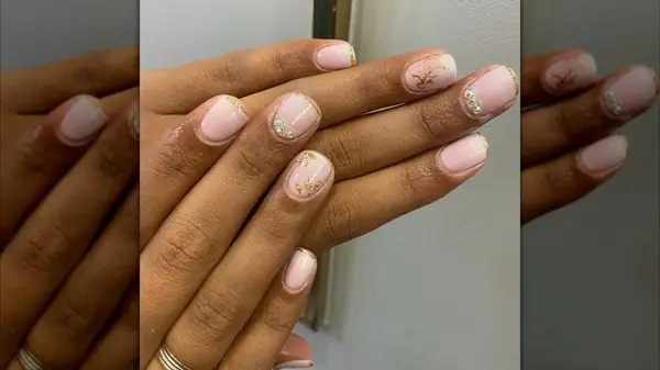 A woman with a gold manicure on Instagram