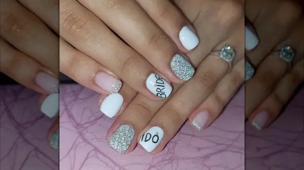 Bridal nails in black, white, and silver on Instagram