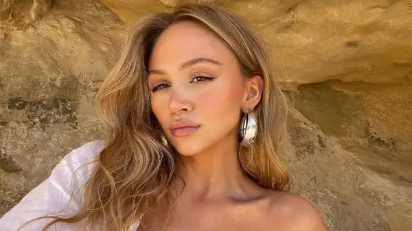 woman posing with middle part haircut