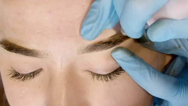 Woman getting powder brows