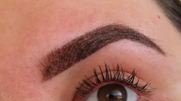 Woman showing powder brows