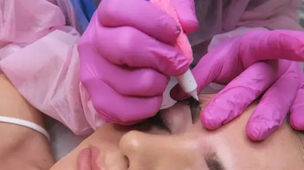 Woman getting powder brows